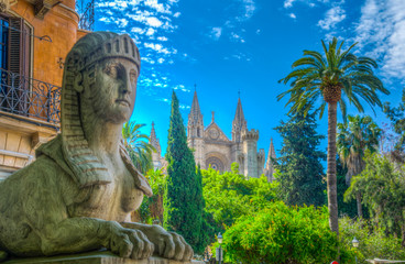 Sphinx statue and the cathedral of Palma de Mallorca, Spain © dudlajzov