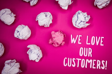 Conceptual hand writing showing We Love Our Customers Call. Business photo text Client deserves good service satisfaction respect Ideas pink background crumpled papers trial mistakes several tries.