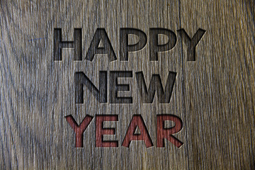 Writing note showing  Happy New Year. Business photo showcasing congratulations Merry Xmas everyone beginning of January Wooden wood background black engraved letters ideas messages concepts.