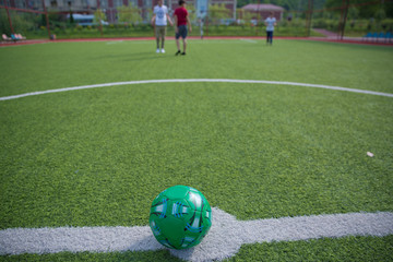 Mini Football Goal On An Artificial Grass . Inside of indoor football field . Mini soccer ball
