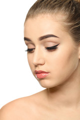 Fototapeta premium Young woman with beautiful eyebrows on white background, closeup