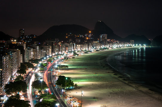 Copacabana Beach at Night with the Sugarloaf Mountain in the Horizon, Rio de Janeiro, Brazil