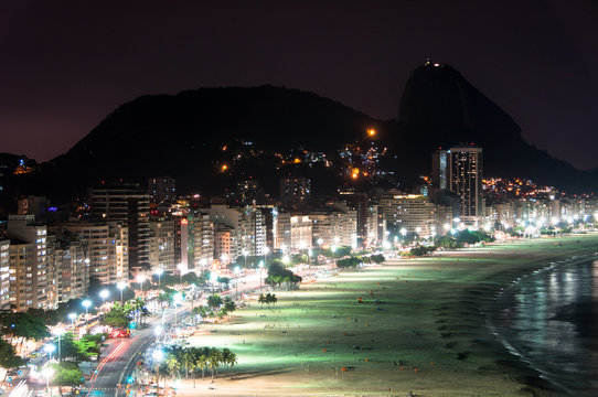 Copacabana Beach at Night with the Sugarloaf Mountain in the Horizon, Rio de Janeiro, Brazil
