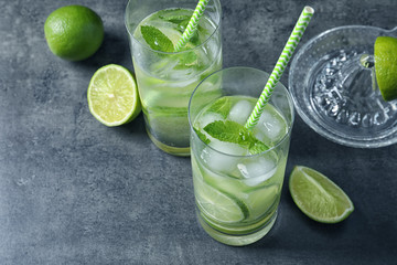 Glasses of natural lemonade with lime on table