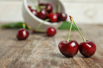 Sweet red cherries on wooden table