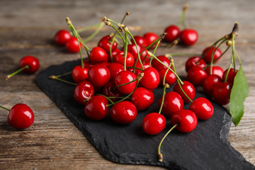 Sweet red cherries on slate plate