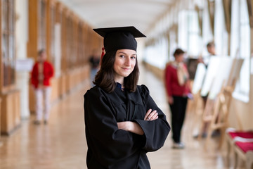Happy caucasian woman on her graduation day at University. Getting high education concept
