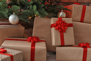Fototapeta na wymiar Beautiful Christmas tree and gift boxes, closeup