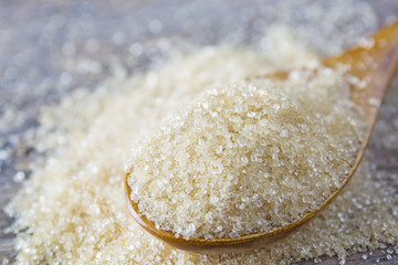 brown sugar heap and wooden spoon