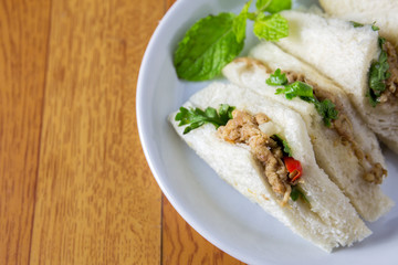 bread sandwich with tuna fish, slices on plate