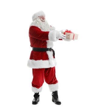 Authentic Santa Claus with gift box on white background