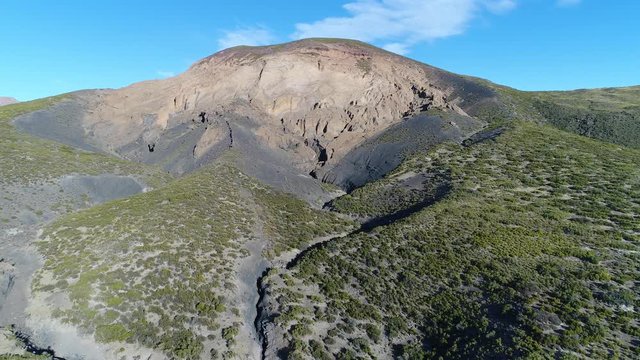 Aerial drone scene of Malacara volcano in Malargüe, mendoza, cuyo, Argentina. Camera moving upwards and forwards. Old touristic volcano in La Payunia National Park. hydromagmatic volcano.