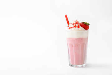 Glass with delicious milk shake on white background