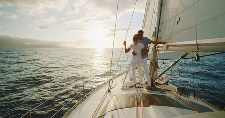 Retired middle aged couple sailing into the sunset