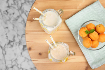 Flat lay composition with delicious milk shakes on table