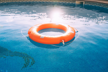 Lifesaver in the swimming pool - Powered by Adobe