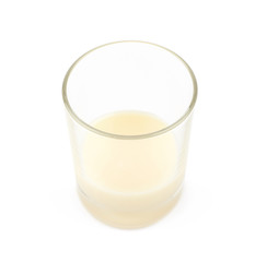 Condensed milk in a glass isolated