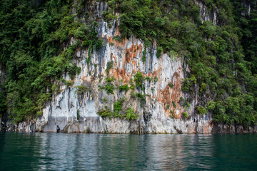 Landscape of linestones mountain between the lake.