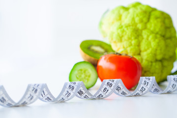 Diet. Fitness and healthy food diet concept. Balanced diet with vegetables. Fresh green vegetables,...
