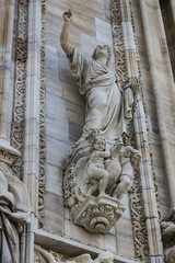 Fototapeta premium Sculptures of saints and martyrs decorating the Cathedral of Milan (Duomo di Milano) are shot close-up. 