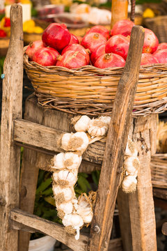 Pomegranates and garlic on display at Campo de Fiori Market, Rome, Lazio