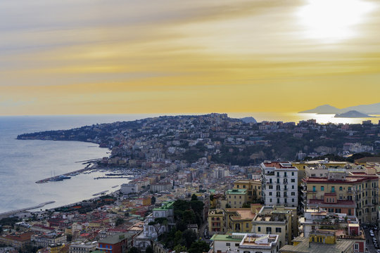 Panoramic sunset view of Mergellina coastal section seen from Sant Elmo castle in Naples, Campania
