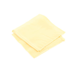 Slice of processed cheese isolated
