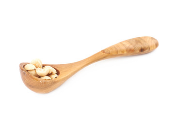 Spoon of salted peanuts isolated