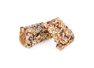 sweetened white and black sesame roll with peanut on white background