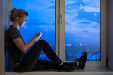 Happy tired traveler lies on the bed high quality hotel.