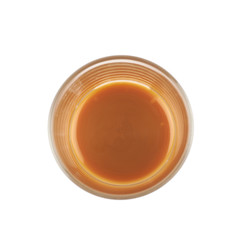 Glass shot of caramel sauce isolated