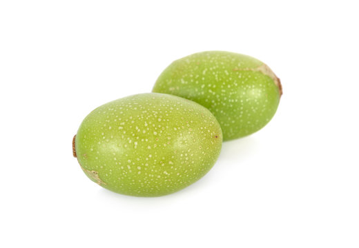 whole fresh hog plum on white background