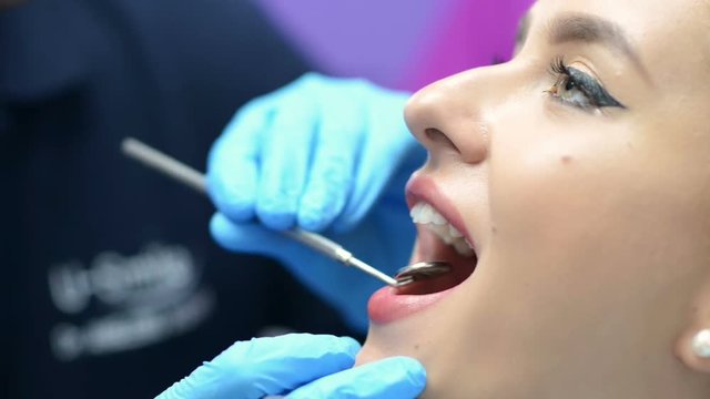 Young beautiful woman getting dental consultation