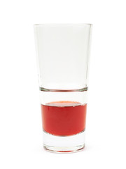 Glass of red juice isolated
