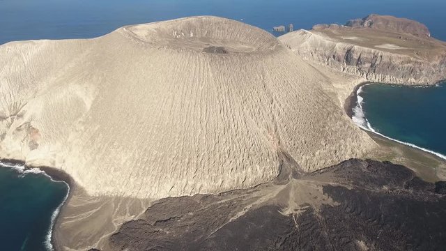 Aerial of volcanic island, crater and cooled lava flow - San Benedicto, Mexico