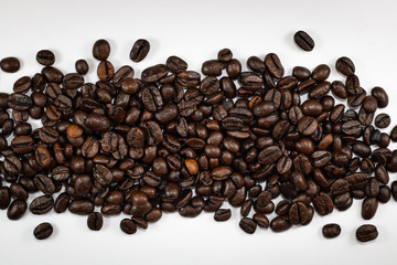 coffee beans on white background . black and brown color seeds textured .