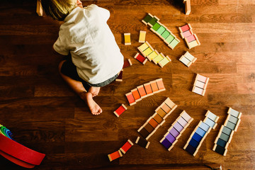 Children playing and learning with montessori color tablets