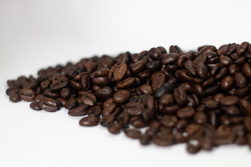 beverage concept of coffee beans heap . black and brown color seeds isolated on white background with copy space
