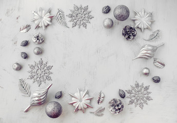 Fototapeta na wymiar Christmas decorative composition of toys on a white background surrealism