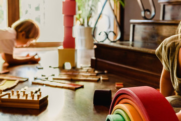 Children playing with wooden rainbow waldorf montessori