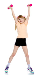 Little girl doing exercises with dumbbells.