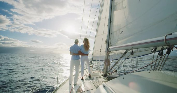 Romantic couple sailing into the sunset