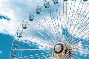 Fototapeta premium Ferris Wheel at Ocean CIty New Jersey Boardwalk with Blue Sky and Epic Clouds