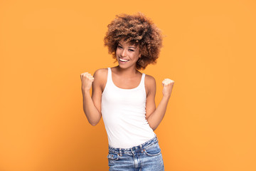 Beautiful happy african american woman celebrating victory.