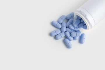Blue Pills For Health And Plastic Bottle Container