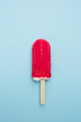 Popsicle with fresh strawberry on pink