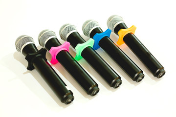 soft focust picture of Wireless microphones for conference in meeting room. It is isolated on white background.