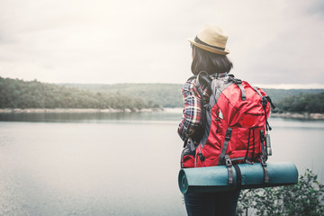Obraz premium Happy Asian woman relaxing on holiday travel concept,selective and soft focus,tone of hipster style