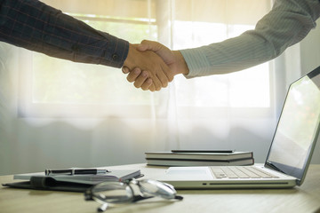 Naklejka na ściany i meble Business handshake. Business people shaking hands, finishing up a meeting,Success agreement negotiation.