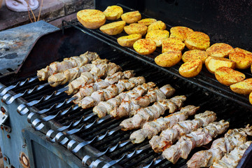Grilled meat with fried potatoes and meat as well as kebabs